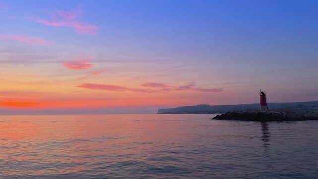 Denia sunrise over Cape San Antonio calm Mediterranean sea