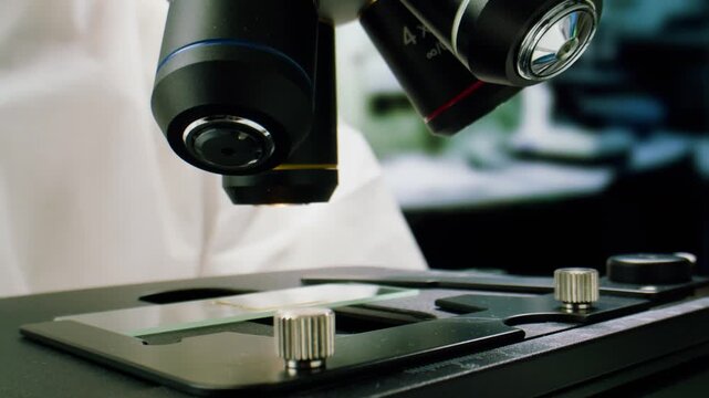 Engineer doctor working with microscope in laboratory, Scientific laboratory with various research equipment, man conducting experiments and research, Science and technology concept.