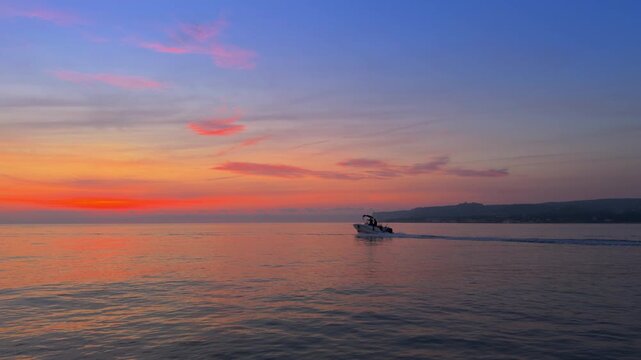 Denia sunrise over Cape San Antonio calm Mediterranean sea