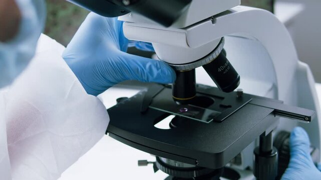 Engineer doctor working with microscope in laboratory, Scientific laboratory with various research equipment, man conducting experiments and research, Science and technology concept.