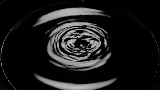 Water Droplet Splashing in Black Background.