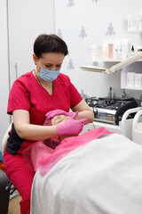 Fototapeta premium A girl at a cosmetologist's appointment. Skin problems. Acne.