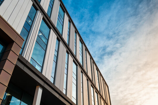 Abstract view of a medical research building located at the famous medical campus in Cambridge, UK. Seen against a winter setting sun.