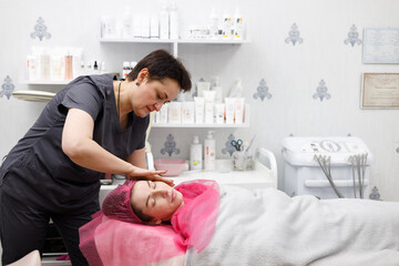 Obraz premium A girl at a cosmetologist's appointment. Skin problems. Acne.