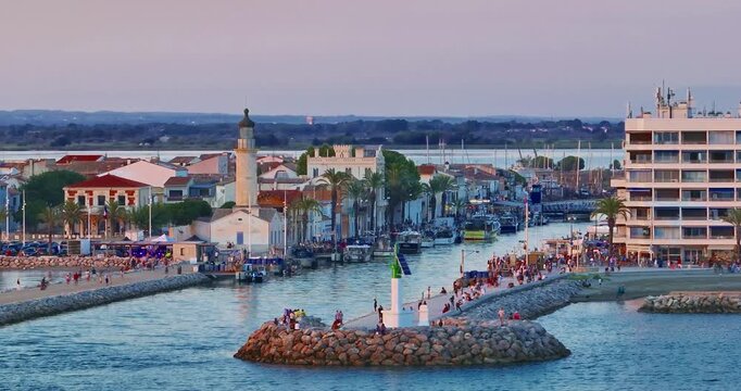 Aerial view of the Grau du Roi fishing village at sunrise in Camargue, a resort on the coast of Occitanie region in France. Beautiful coast town Grau du Roi in southern France
