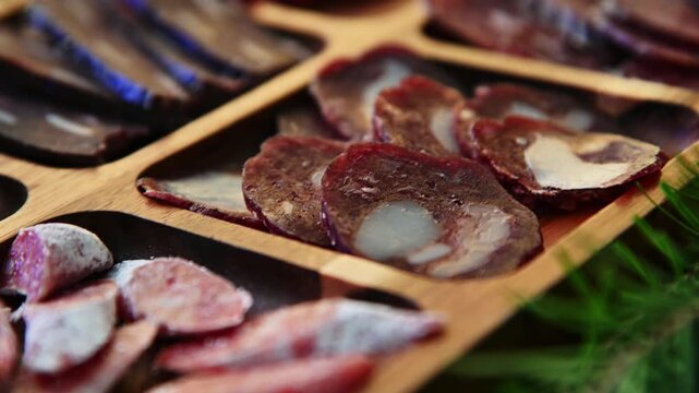 Close-up of a plate of cold cuts of sausages and ham