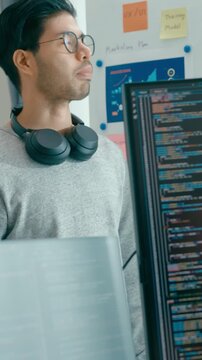 Vertical Screen : Group adult Asia male female software developers mentor leader manager talk strategy plan executive write prompt AI bot app nomad, video game, data center. Whiteboard slideshow code.