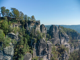 Fototapeta premium telephoto shoot of distant rock formations in Saxon Switzerland