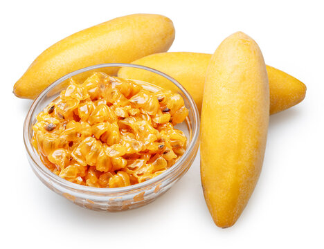 Curuba or banana passion fruits and glass bowl with curuba juicy pulp and black seeds on white background. File contains clipping paths.