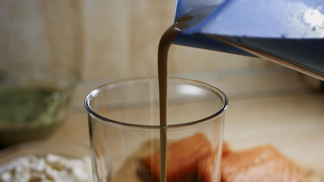 Pouring pancake batter into blender jar