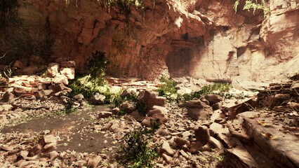 Obraz premium Bright sunlight filters through a narrow canyon, illuminating scattered rocks and lush greenery. This tranquil spot invites exploration and connection with nature.