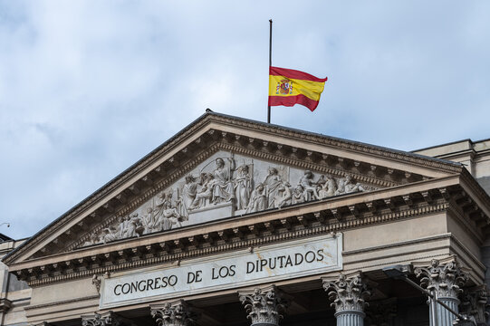 The Spanish flag waving at half-mast at the Congress of Deputies of Madrid, Spain