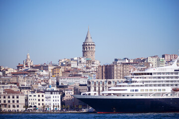 Fototapeta premium View of Istanbul cityscape Galata Tower with floating tourist boats in Bosphorus ,Istanbul Turkey