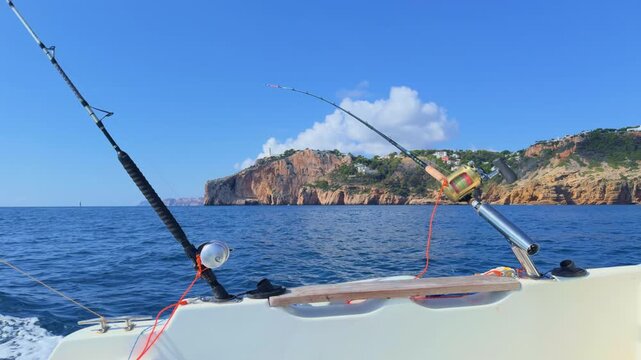 Costa Blanca trolling fishing rods on boat near Cape de la Nao in Alicante