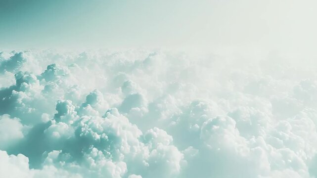 Fluffy white clouds gently filling the vast blue sky, creating a serene and ethereal backdrop, symbolizing peace, freedom, and atmospheric beauty from an aerial perspective