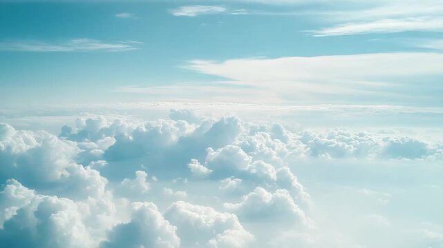 Endless sea of fluffy white cumulus clouds beneath a clear blue sky, panoramic aerial view conveying serene, dreamlike calm and boundless open atmosphere for travel or backdrop