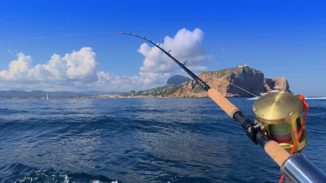 Javea bay trolling fishing rod on boat Mediterranean Costa Blanca