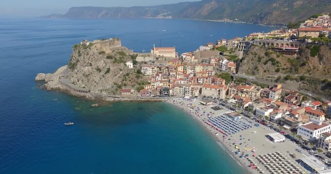 Aerial view of the historic center of the town of Scilla, in Calabria, Italy. Panorama of a beautiful village located on a promontory overlooking the Mediterranean Sea. In foreground it's the beach.