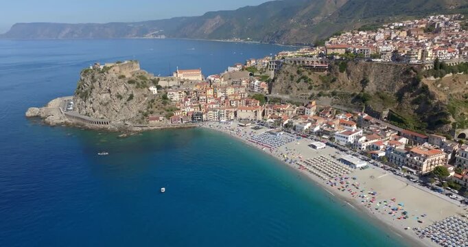 Aerial view of the historic center of the town of Scilla, in Calabria, Italy. Panorama of a beautiful village located on a promontory overlooking the Mediterranean Sea. In foreground it's the beach.