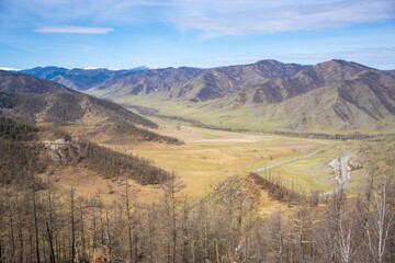 View of Chuysky Trakt valley from Chike Taman pass Altai Russia. Panoramic mountain valley landscape in Siberian region.