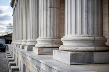 Classic marble columns architecture exterior building detail close-up white stone structure urban design elegant historic facade