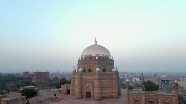 Aerial view of the Tomb of Shah Rukn-e-Alam, a pre-Mughal architecture with its intricate brickwork and domed structure, Multan, Punjab, Pakistan.