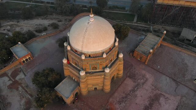 Aerial view of the Tomb of Shah Rukn-e-Alam, a pre-eminent Sufi saint, its pale dome contrasting with the surrounding landscape, Multan, Punjab, Pakistan.