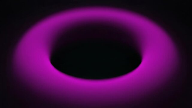 A glowing torus shape shifts colors from teal to magenta. This abstract animation evokes a sense of cosmic wonder.