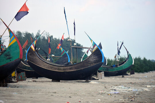 Moon Boat at Cox&rsquo;s Bazar Beach, Bangladesh. A traditional moon-shaped fishing boat resting along the shoreline of Cox&rsquo;s Bazar, Bangladesh.