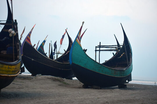 Moon Boat at Cox&rsquo;s Bazar Beach, Bangladesh. A traditional moon-shaped fishing boat resting along the shoreline of Cox&rsquo;s Bazar, Bangladesh.