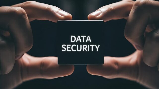 Person holding black cube with data security text cybersecurity concept digital protection privacy information safety