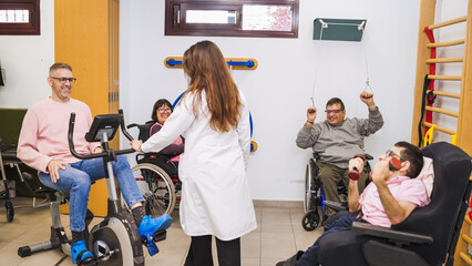Diverse group of people with disabilities engaged in physical therapy exercises with a physiotherapist in a bright clinical setting