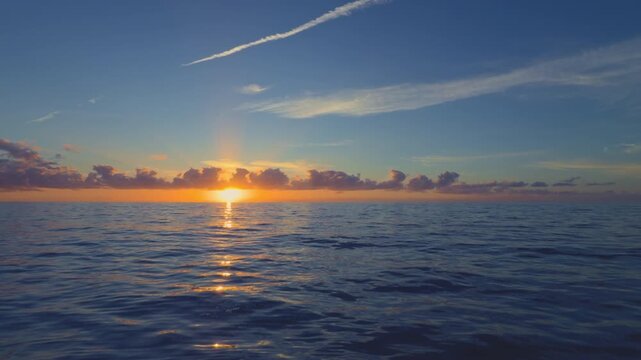 Mediterranean Sea sunrise over calm water and horizon