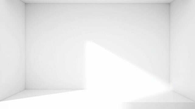 A minimalist white room with soft light casting shadows. The empty space evokes a sense of calm and possibility.