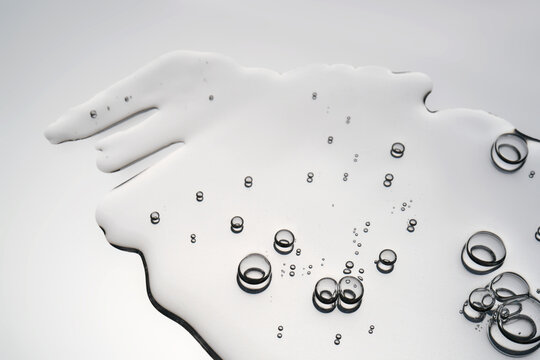 Clear liquid spreading with oxygen bubbles