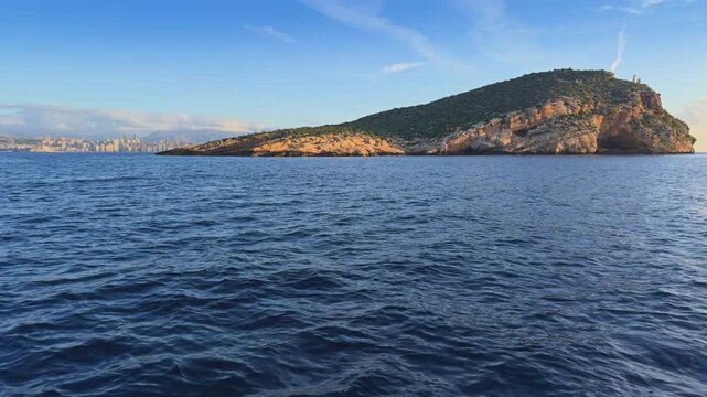 Benidorm Island and city skyline from boat Costa Blanca Spain