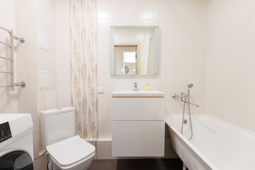 modern bathroom room with toilet and washing machine