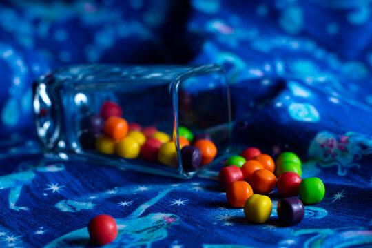 Red, green, yellow, purple and orange candies up close. 