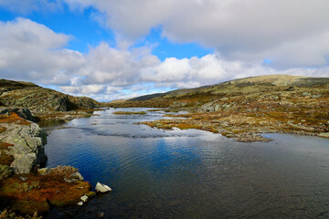 Fototapeta premium Peaceful Scandinavian highland landscape. Mountain River and Plateau on Aurlandsfjellet Tourist Route, Aurland, Vestland county, Norway. 