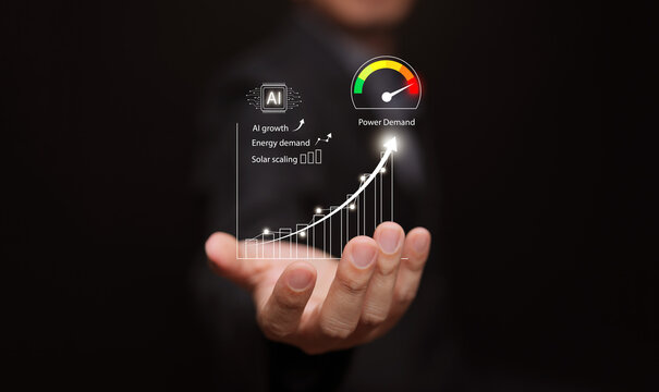 AI growth and rising power demand. A businessman holding a graph of increasing energy needs and a surge in electricity and solar power consumption for artificial intelligence infrastructure.