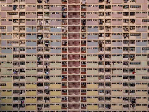 Aerial view of the vibrant rainbow hues of the facade creating a stunning mosaic of urban living, Hong Kong, Hong Kong.