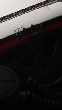 Vertical video old typewriter showing a series of question marks on a white sheet of paper, symbolizing doubt, inquiry, search for answers, uncertainty, and unresolved conceptual issues