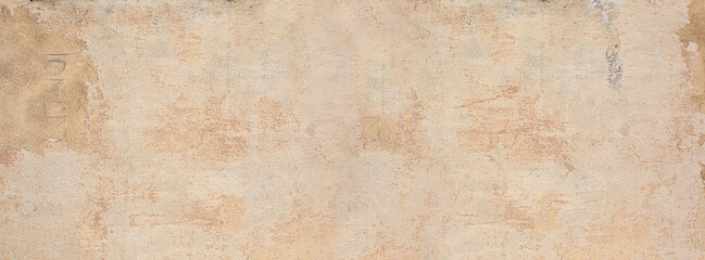 Weathered beige stucco wall background with grunge texture