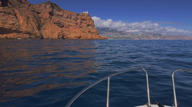 Altea boat cruising near Albir lighthouse Serra Gelada Costa Blanca