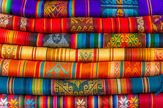 Andes textiles fabrics pile, Otavalo poncho market, Ecuador.