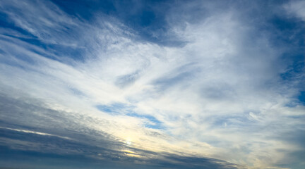Obraz premium Panorama of daytime sky with clouds. Sky background, daylight sky with lighted clouds. Beauty clouds over sea