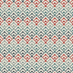 Fototapeta premium Ethnic, tribal seamless pattern. Native americans embroidery textile stylized surface print. Boho chic ornament. Repeated triangles geometric background. Colorful mosaic wallpaper. Vector abstract