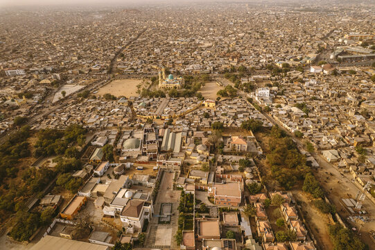 Aerial view of the Emir's Palace and the Great Mosque stand as cultural beacons amidst the sprawling urban tapestry, Kano, Kano, Nigeria.
