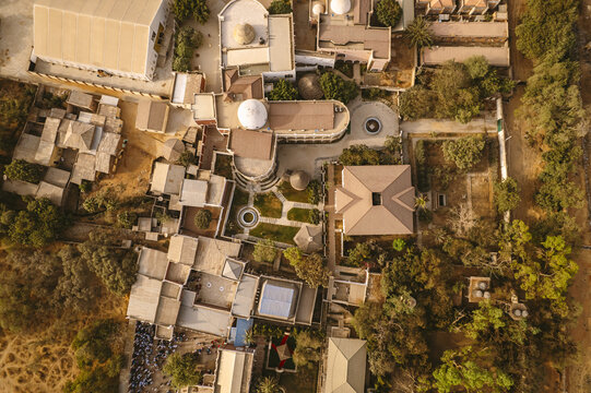 Aerial view of Emir Palace Road reveals structures interspersed with greenery in a harmonious blend of built and natural environments, Kano, Kano, Nigeria.