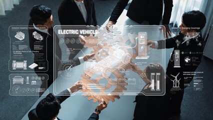 A dynamic team collaborates in a modern office, discussing electric vehicle technology and...